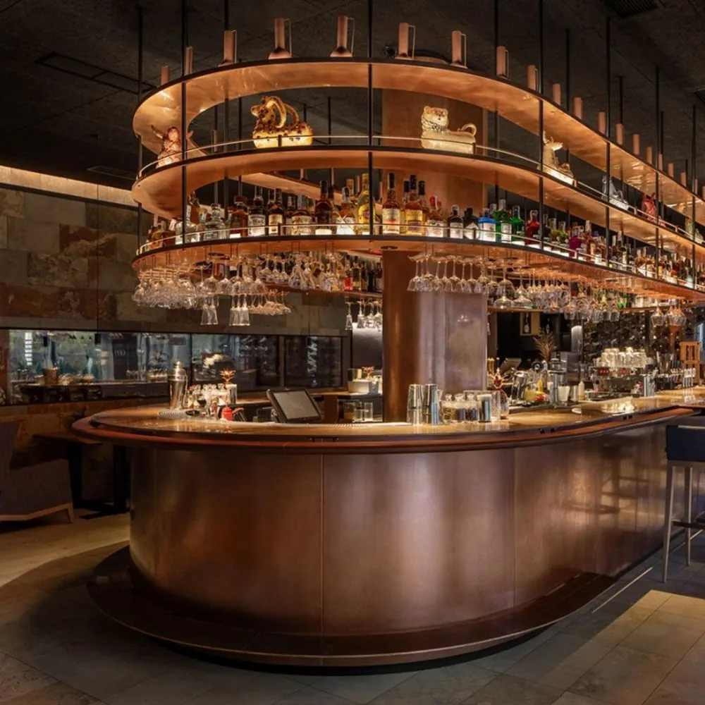 L-Shape Bar Table with Stone or Metal Top — installed view with bar counter