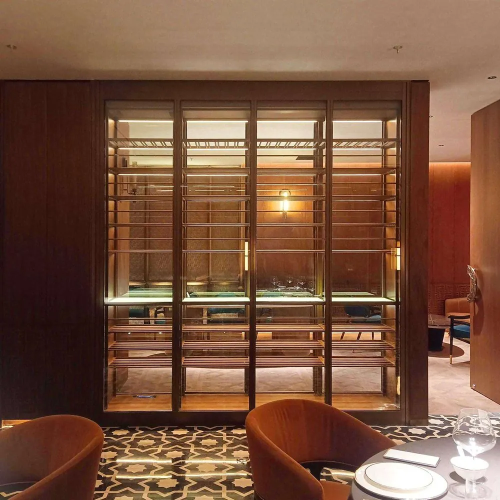 Stainless Steel Wine Cabinet with Glass Door — installed view in dining area