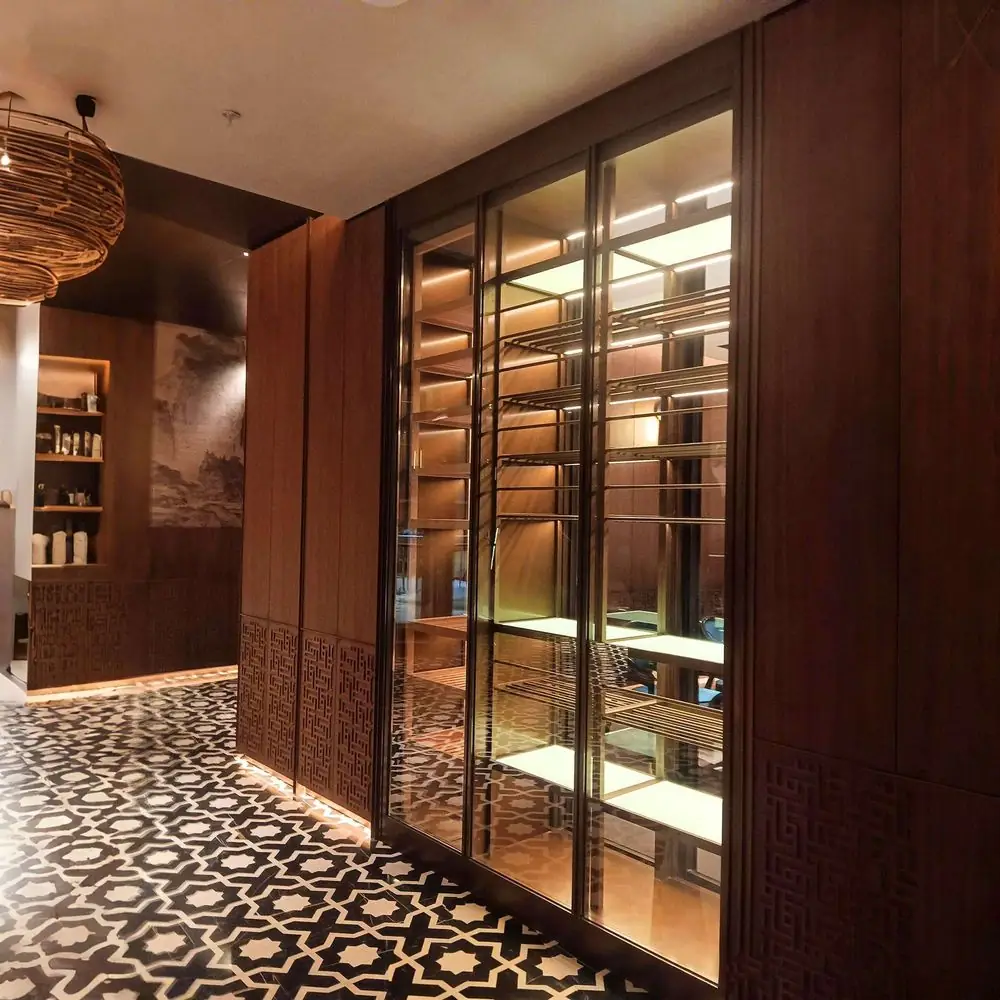 Stainless Steel Wine Cabinet with Glass Door — in-situ view with brick