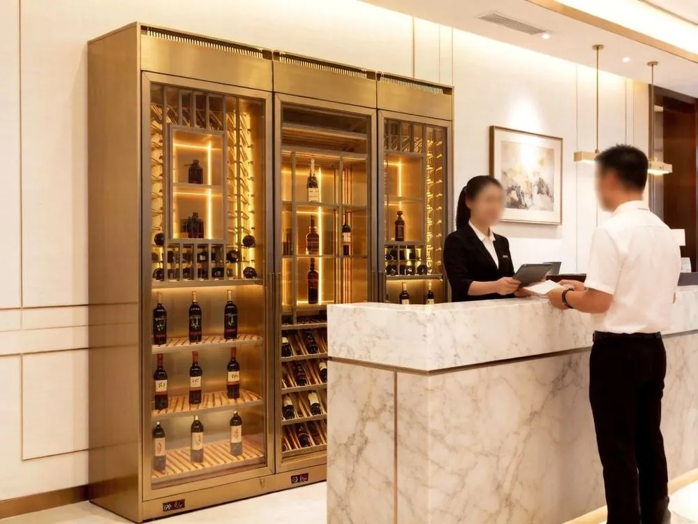 1000L Dual-Zone Stainless Steel Wine Cooler — in-situ view with gold finish