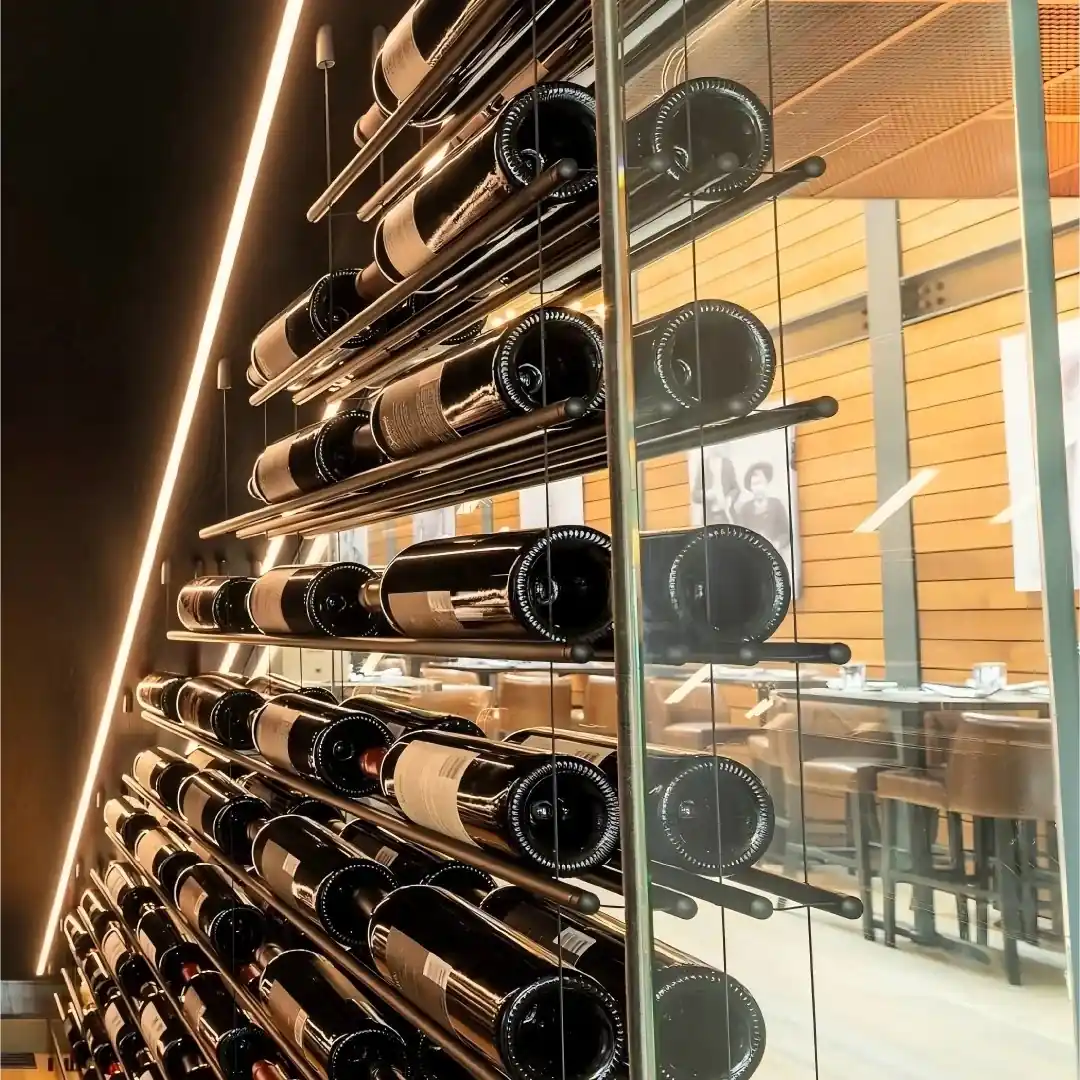 Under-Stair Glass Wine Cellar Enclosure — construction detail of wine bottles